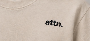 The small attn. logo on the chest